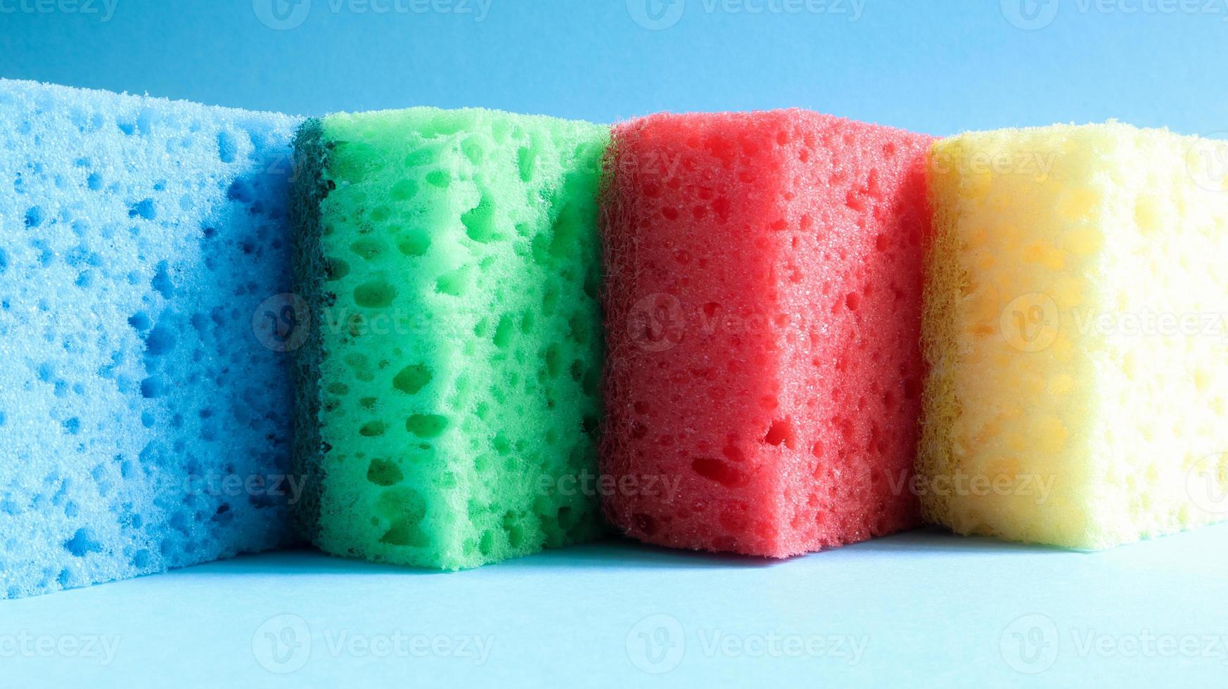 Many blue, red, yellow, green sponges are used to wash and wipe the dirt used by housewives in everyday life. They are made of porous material such as foam. good detergent retention photo