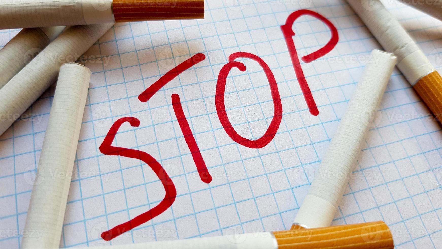 A sticker that says Stop is in a pack of cigarettes. World No Tobacco Day. Quit smoking. Fight with cigarettes photo