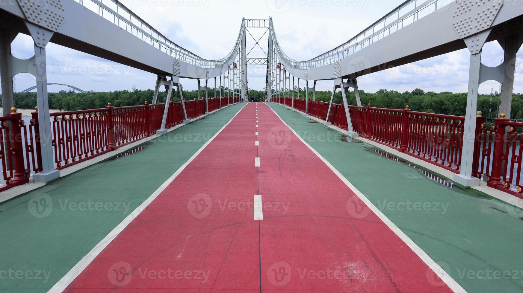Park pedestrian bridge over the Dnieper River, which connects the central part of Kiev with the park area and the beaches of Trukhanovy Island. Without people. photo