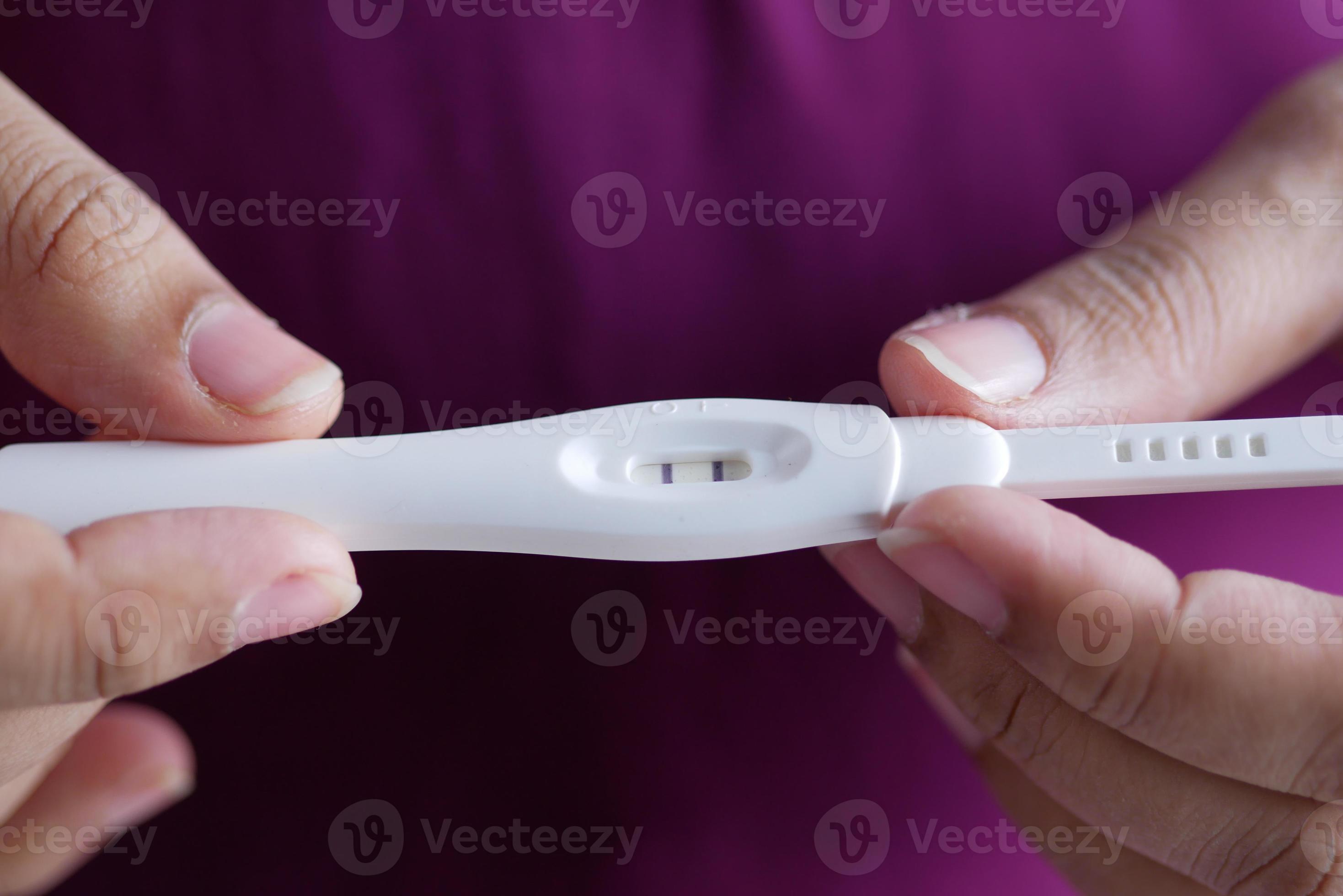 women holding Pregnancy test kit with positive result 5540654 Stock
