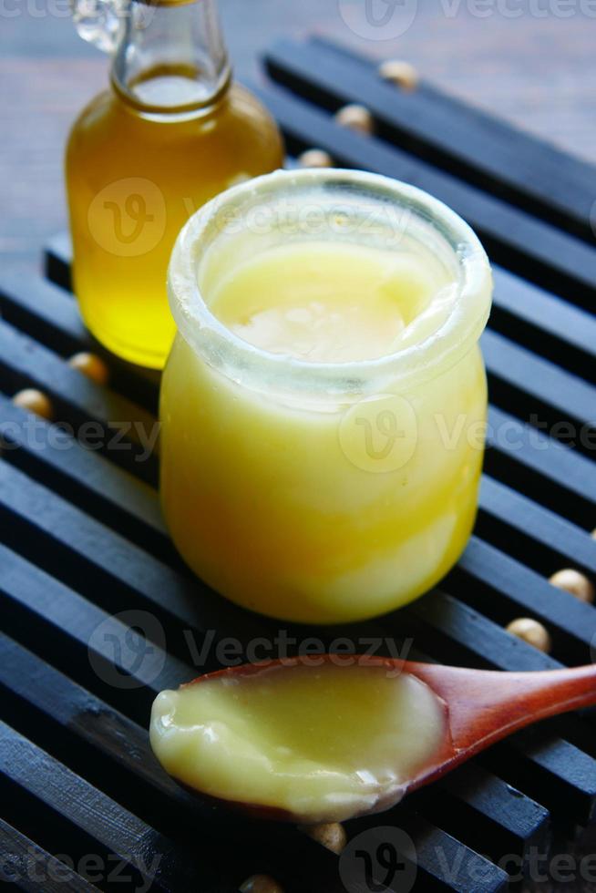 homemade ghee in container on a table , photo