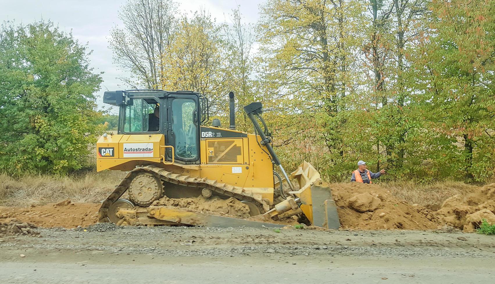 Ukraine, Kiev, October 1, 2019-Construction equipment and worker photo