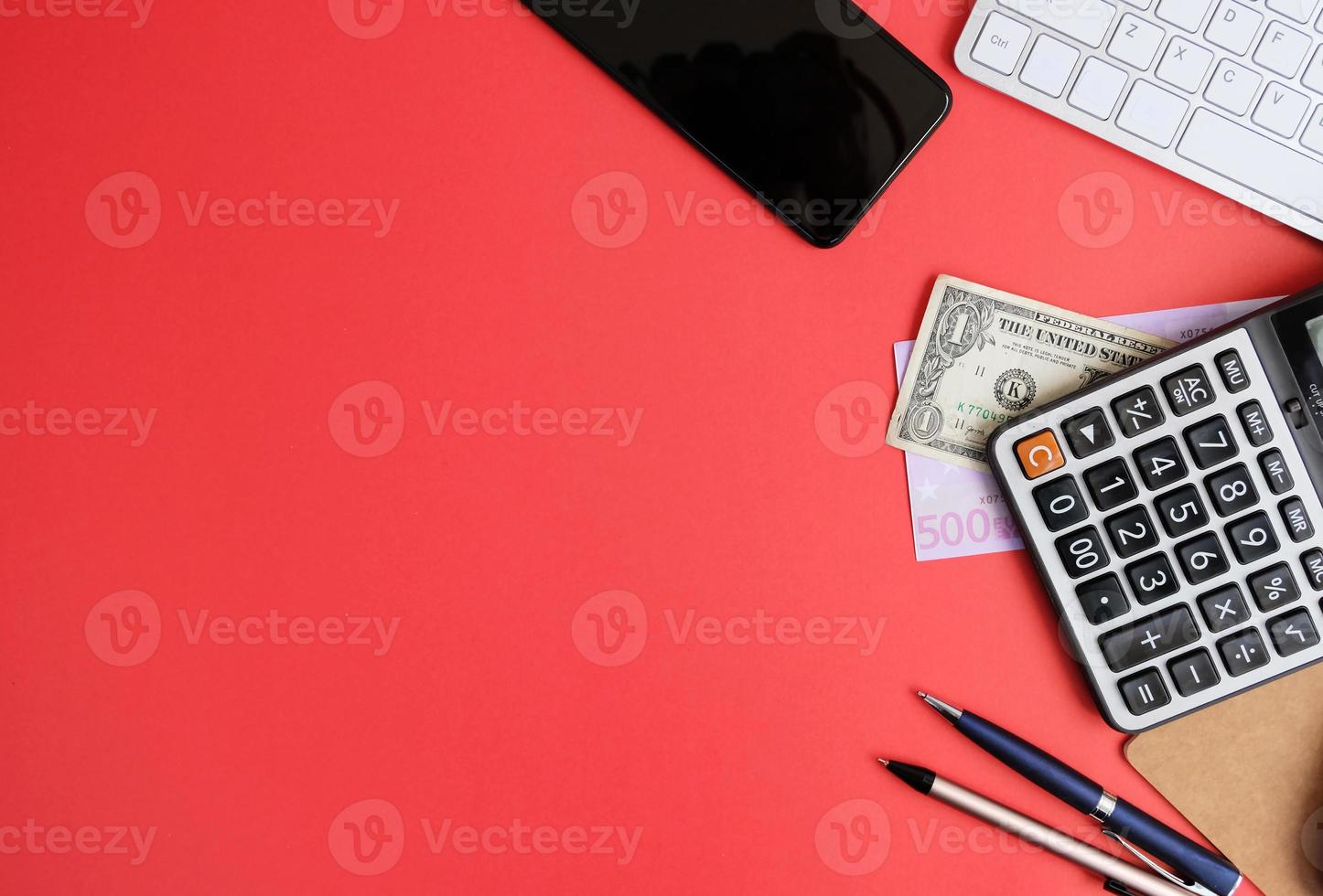 Notebook with pen are on top of office desk table with computer tools and supplies. Top view with copy space, flat lay.  Finance and banking advertising photo