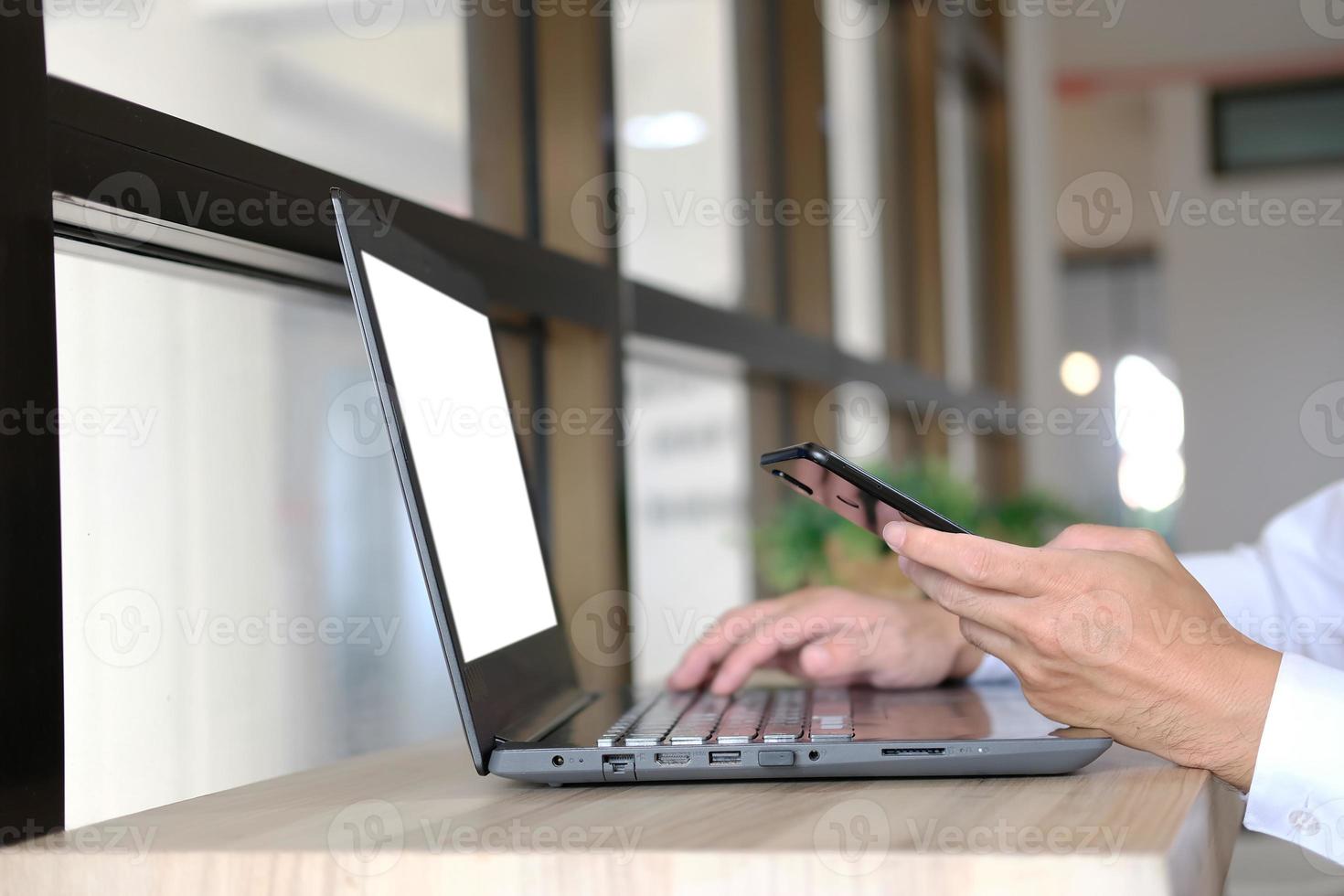 Businessman utilizing mobile smartphone and network connection photo