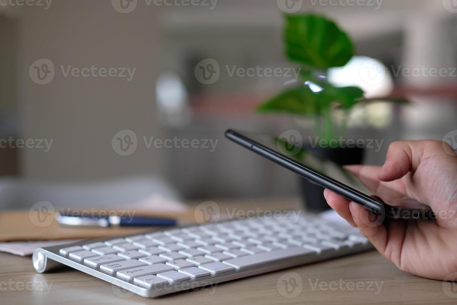 Businessman utilizing mobile smartphone and network connection photo