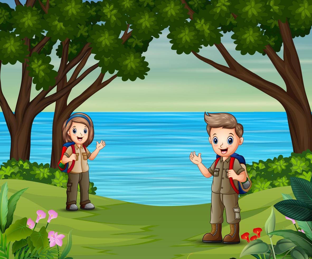 Cartoon boy and girl in explorer outfit on the nature vector