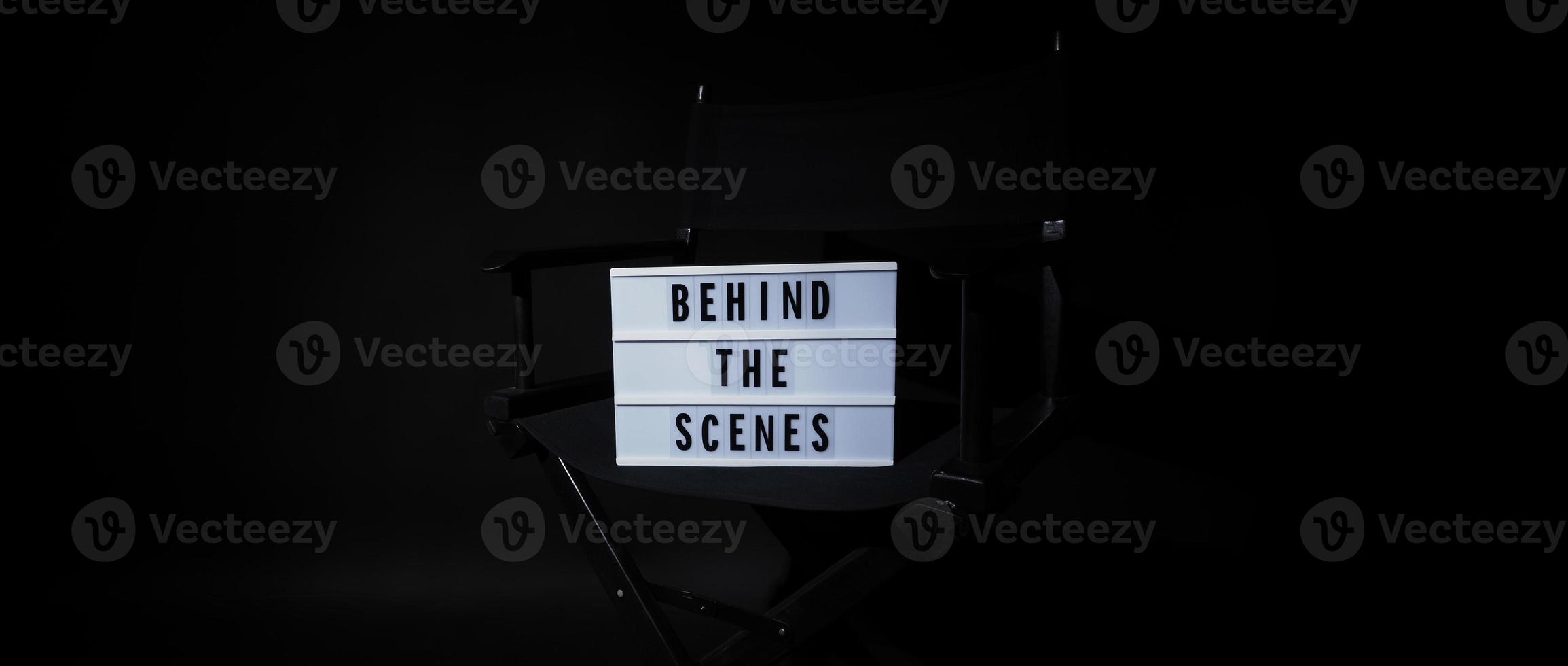 Director chair with behind the scene banner light box. photo