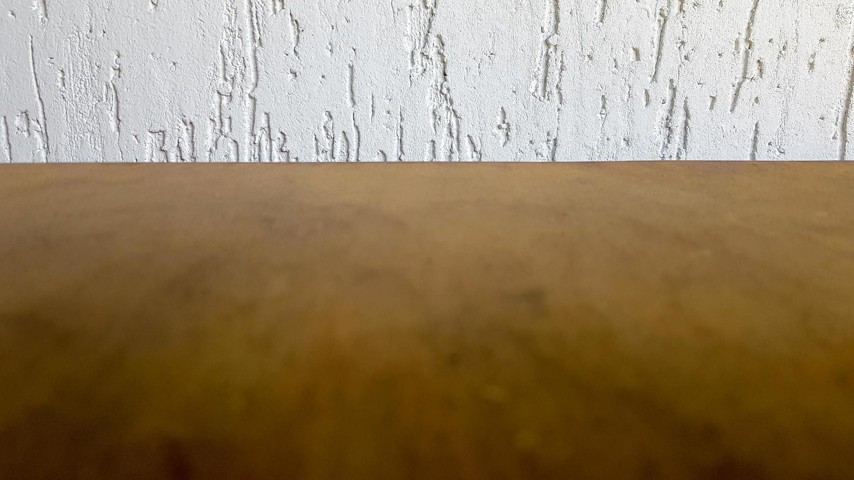 Empty top of a natural wooden table and retro white decorative wall. To display the product. Wooden table and white wall. Empty wooden tabletop, counter, shelf in the wall of the room photo