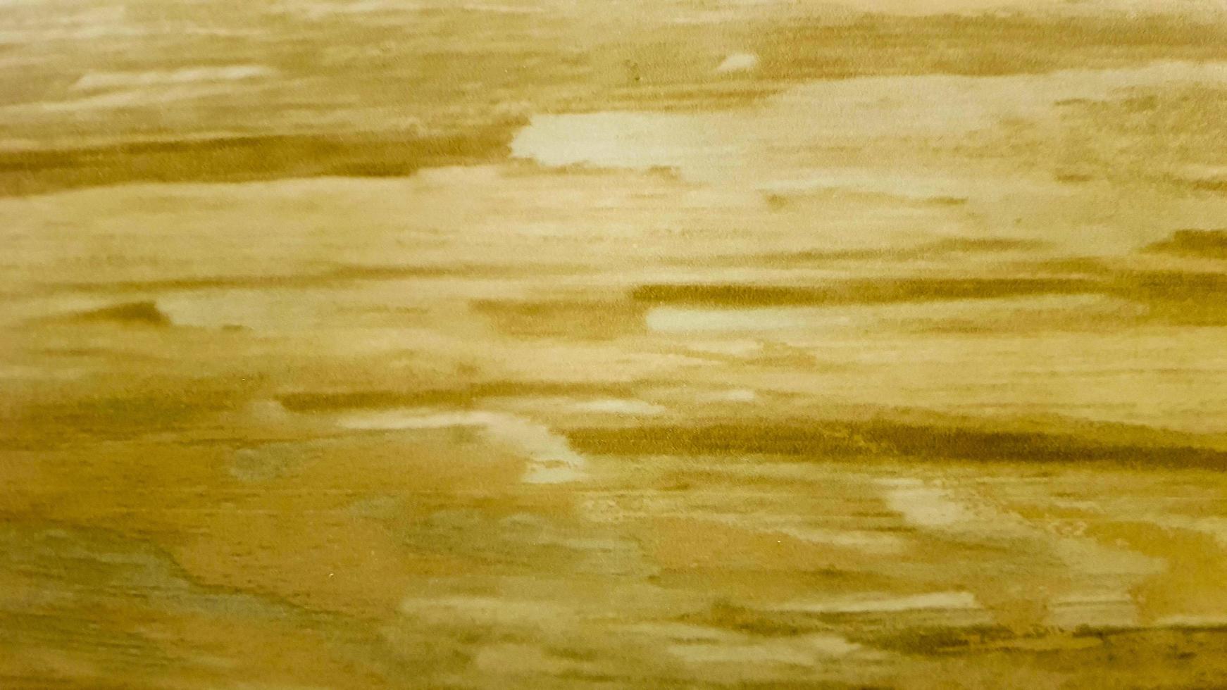 Gold background or texture and gradient shadow. wall and floor gold yellow mosaic tiles texture background. Metal texture background in gold.Panorama gold texture photo