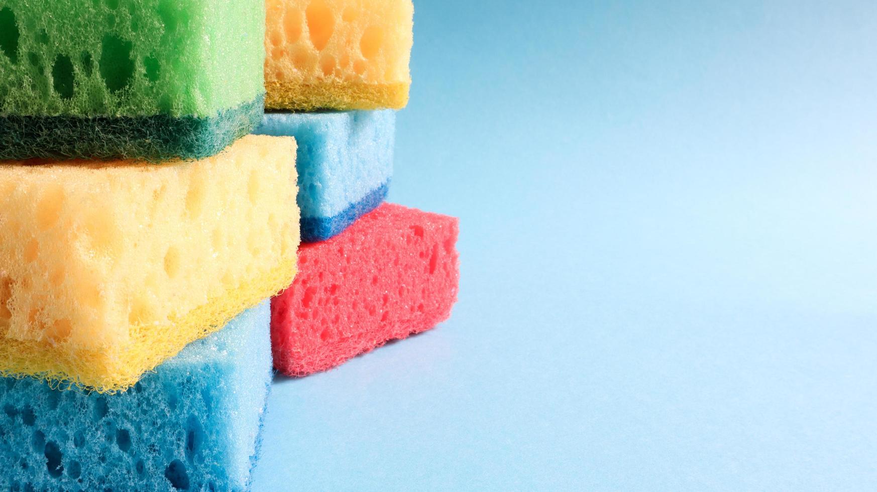 Many blue, red, yellow, green sponges are used to wash and wipe the dirt used by housewives in everyday life. They are made of porous material such as foam. good detergent retention photo