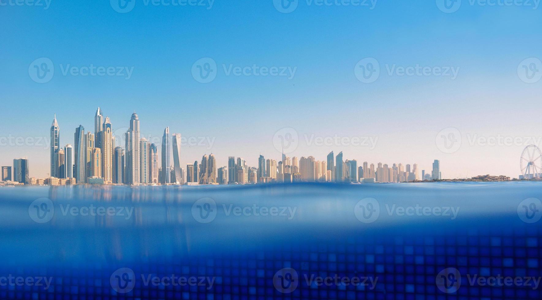 Cityscape of modern Dubai Marina with reflection in water. Travel concept photo