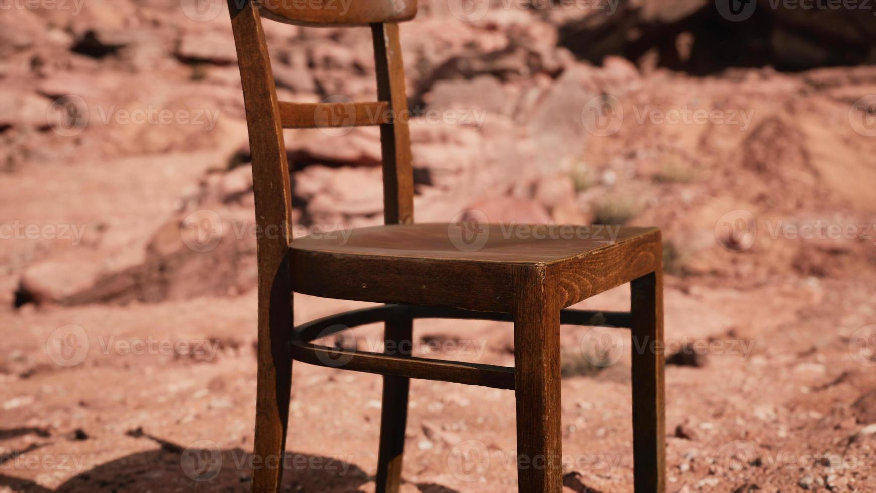 old wooden chair on rocks of Grand Canyon photo