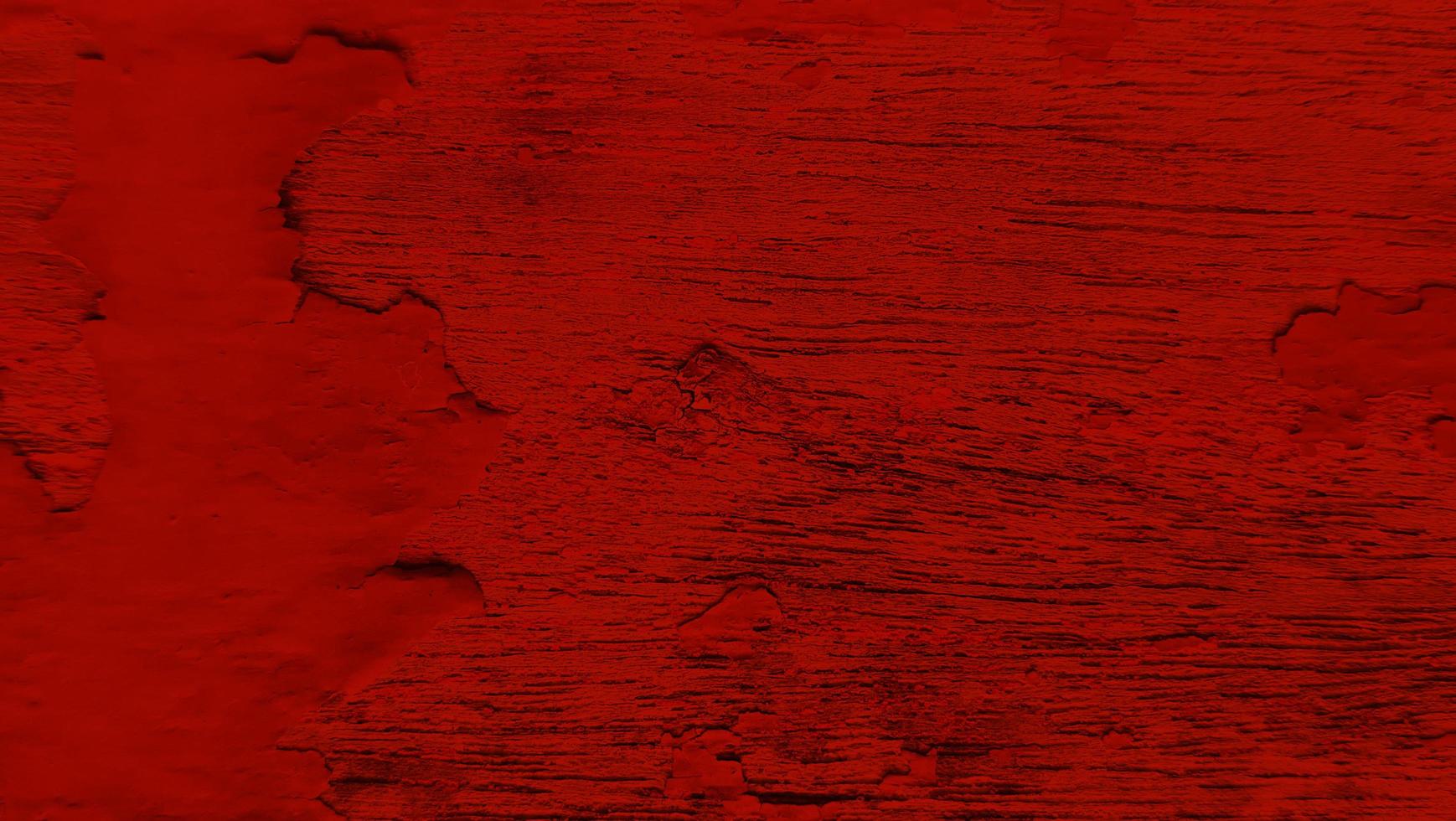 Red peeled paint of wooden plank texture photo