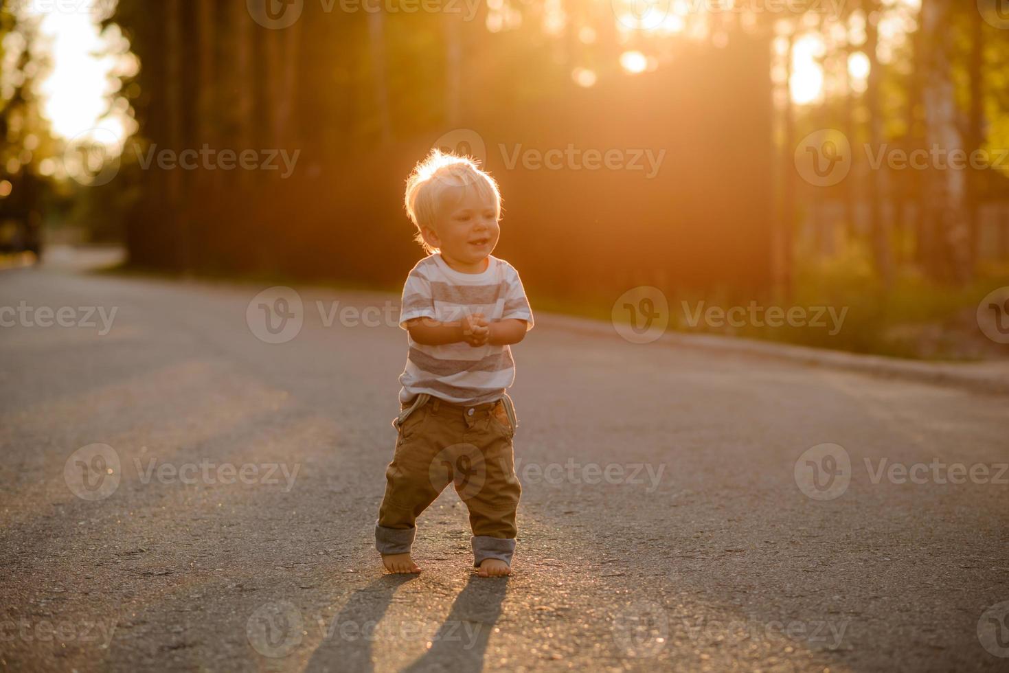 Cute boy with blond hair and blue eyes photo