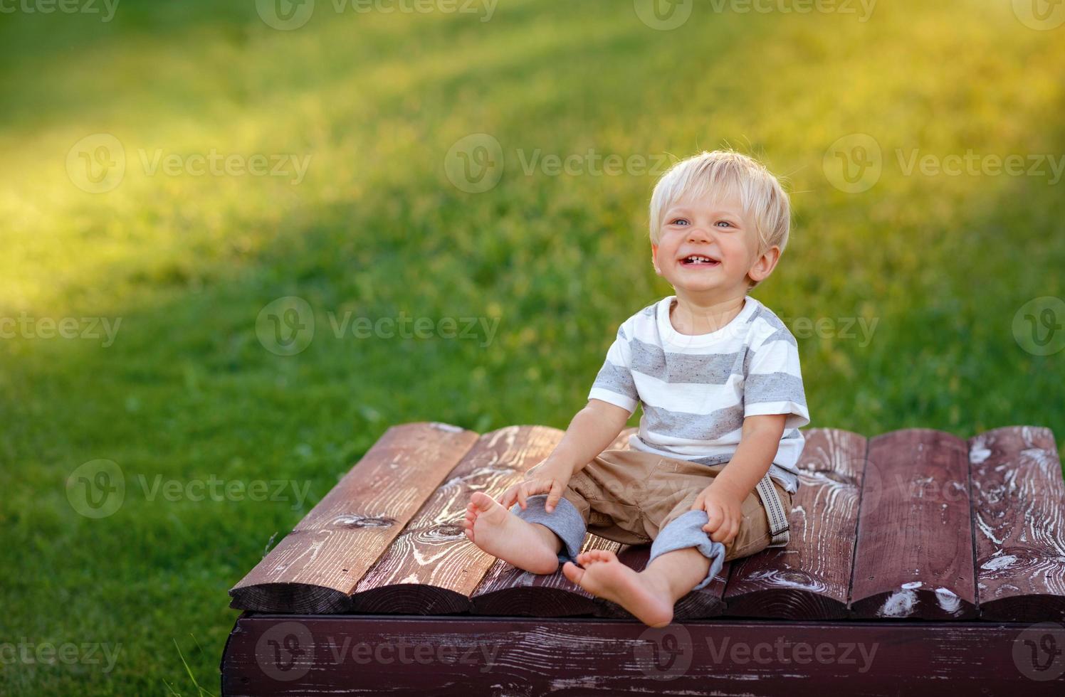 Cute boy with blond hair and blue eyes photo