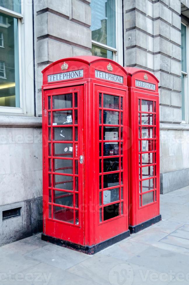 Traditional british red phone booth in London, UK photo