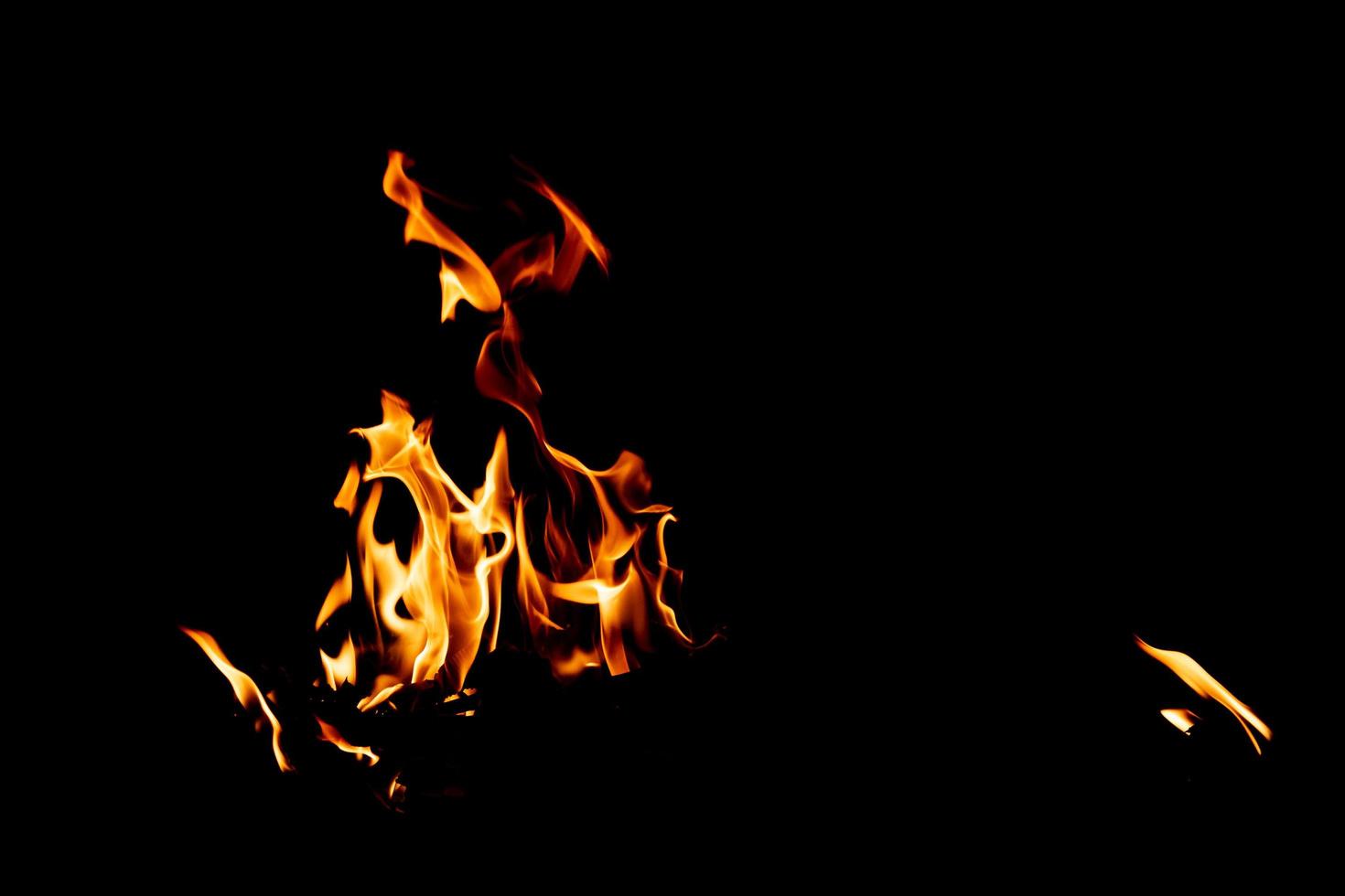 Fire flame texture. Burning material backdrop. Burn effect pattern. Blaze and torch wallpaper. Heat and haze backdrop. photo