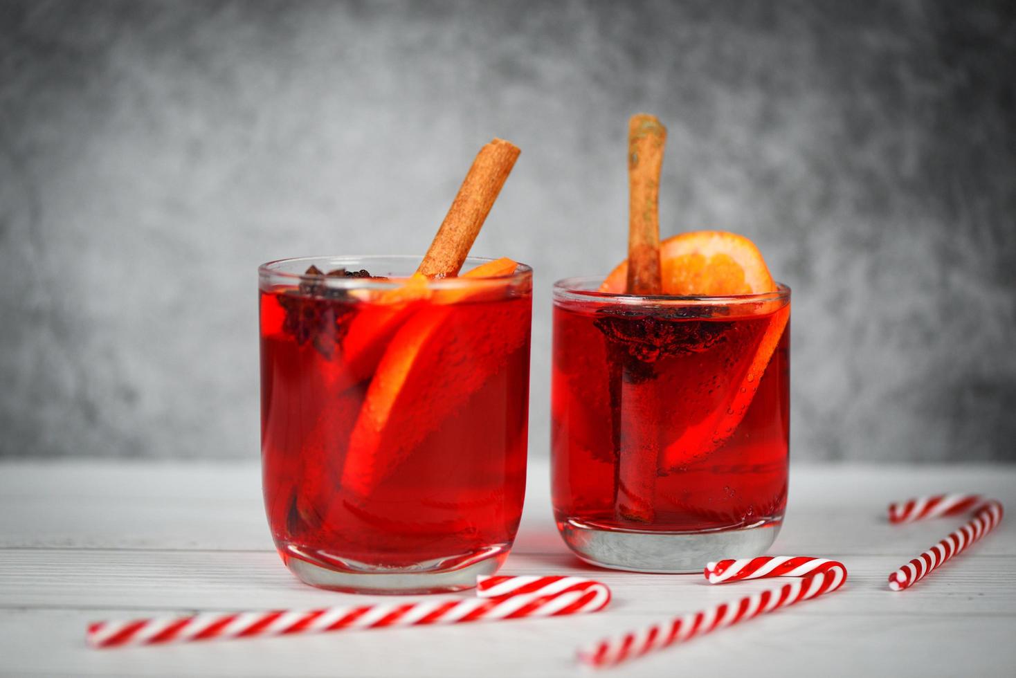 Christmas mulled wine delicious holiday like parties candy cane orange cinnamon star anise spices for traditional christmas drinks winter holidays homemade red mulled wine glasses photo