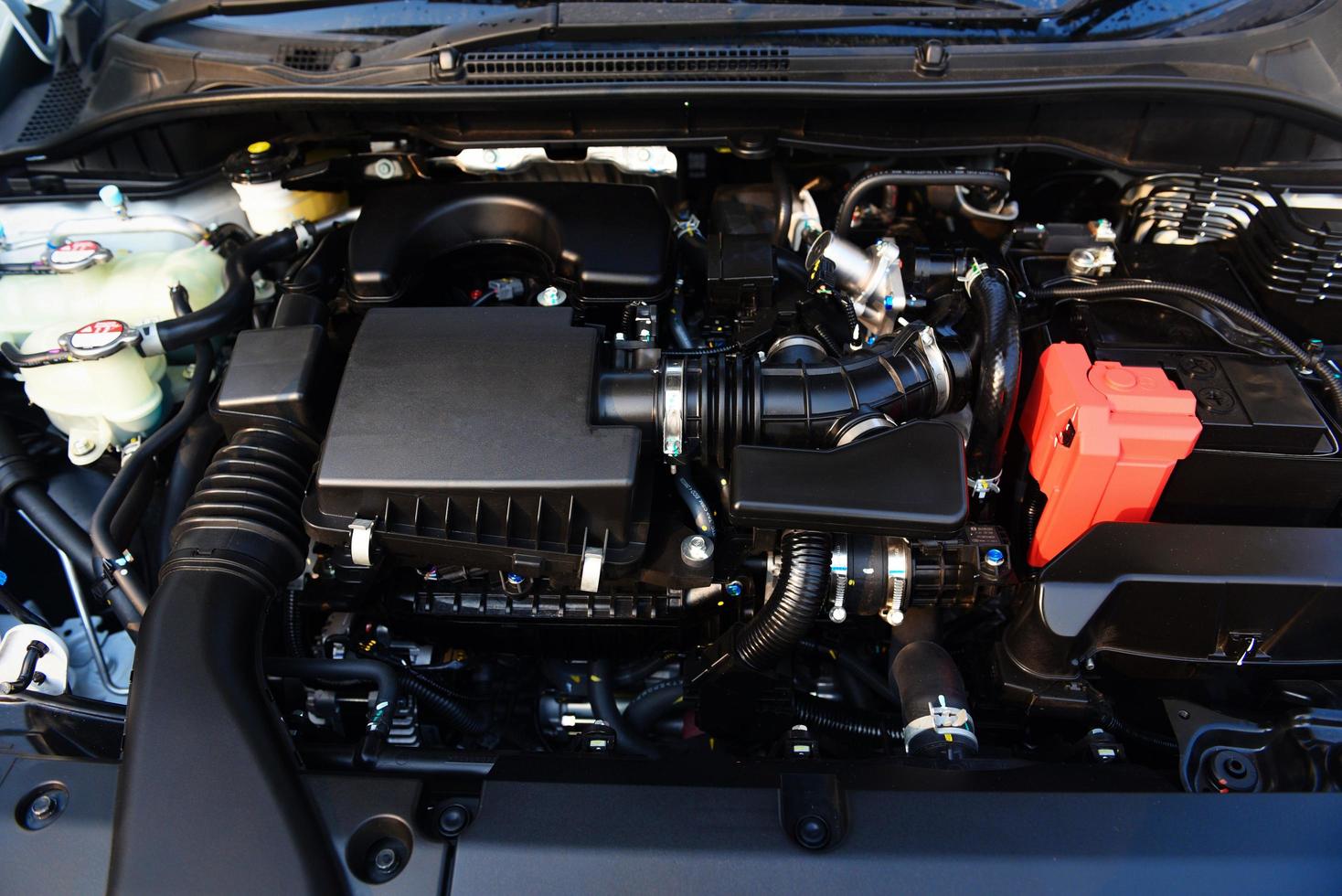 New car engine detail - close up of machine eco car engine motor checking and cleaning for deliver customers in the car service photo