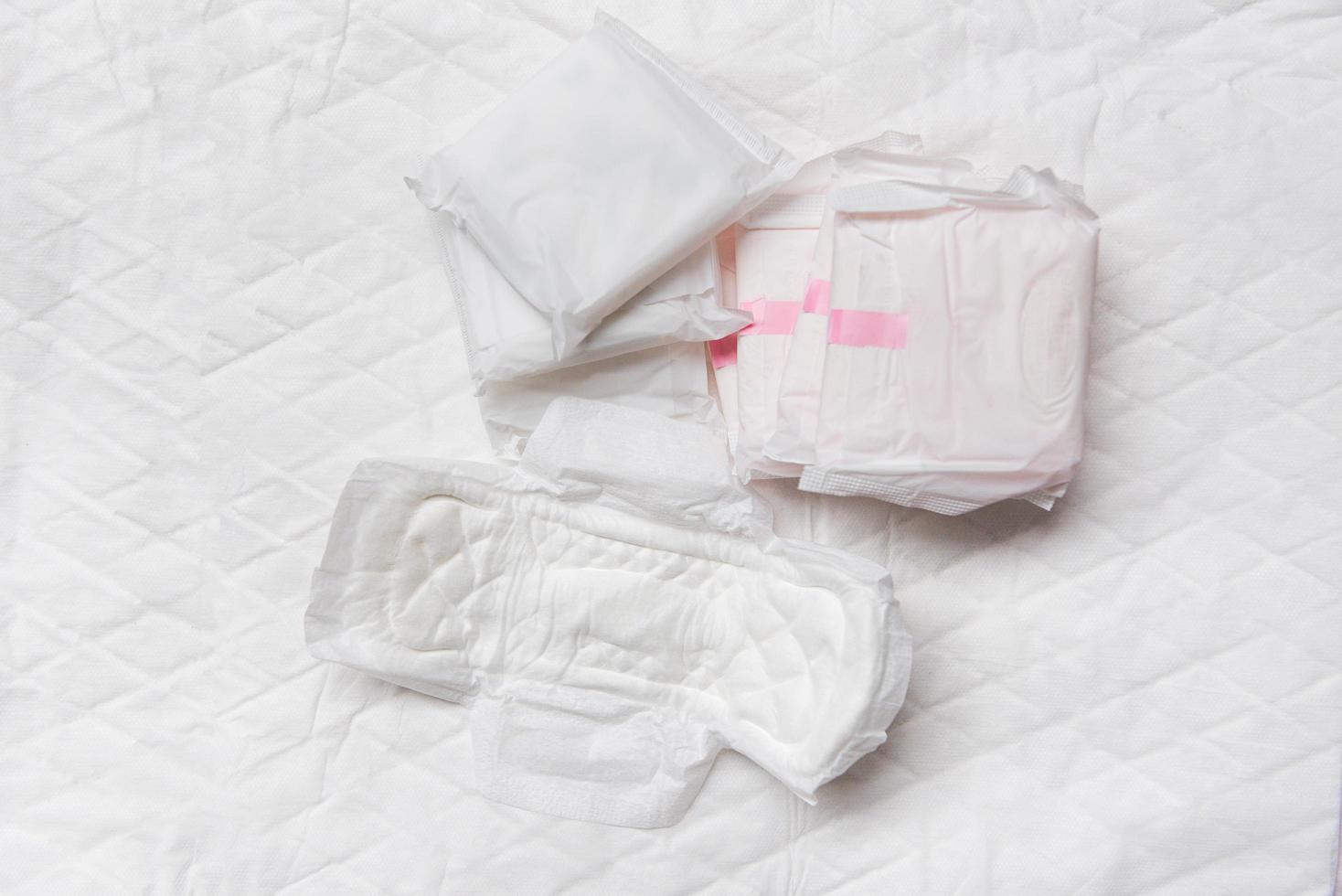 Sanitary napkin or feminine sanitary pad - Female hygiene means women Period Product absorbent sheets photo