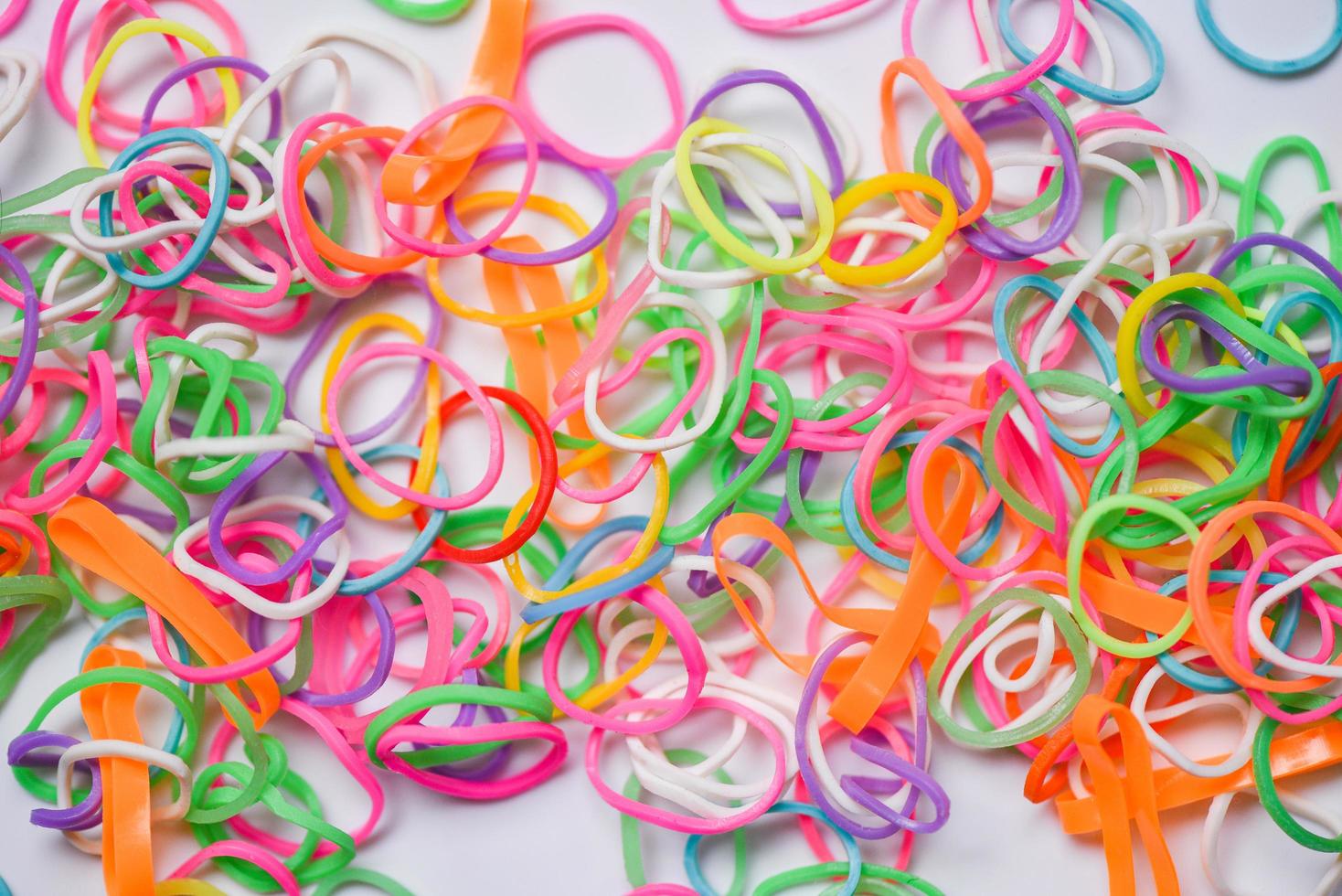 a lot of colored rubber bands on a white background, Stock image