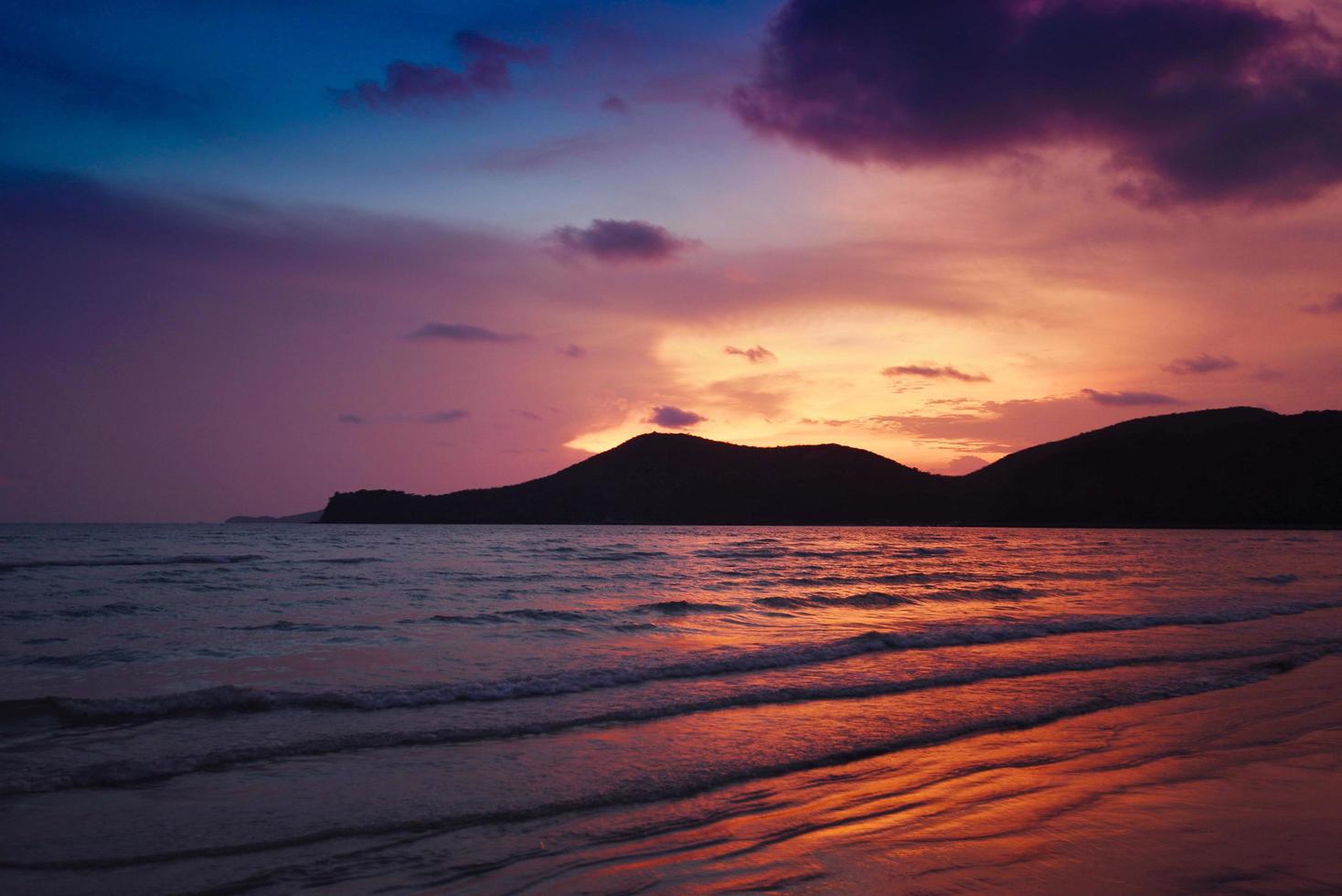 beach sunset silhouette islands beautiful beach sandy on the tropical sea summer colorful orange and blue sky mountain photo