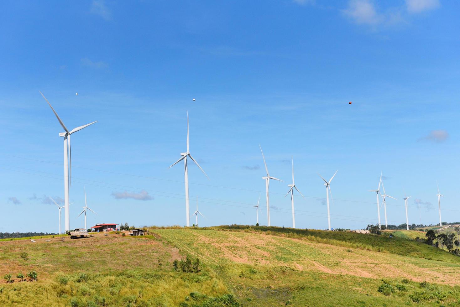 wind turbine landscape natural energy green Eco power concept at wind turbines farm blue sky background. photo
