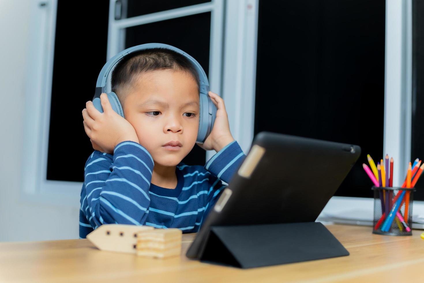 Children study online through tablets at home. photo