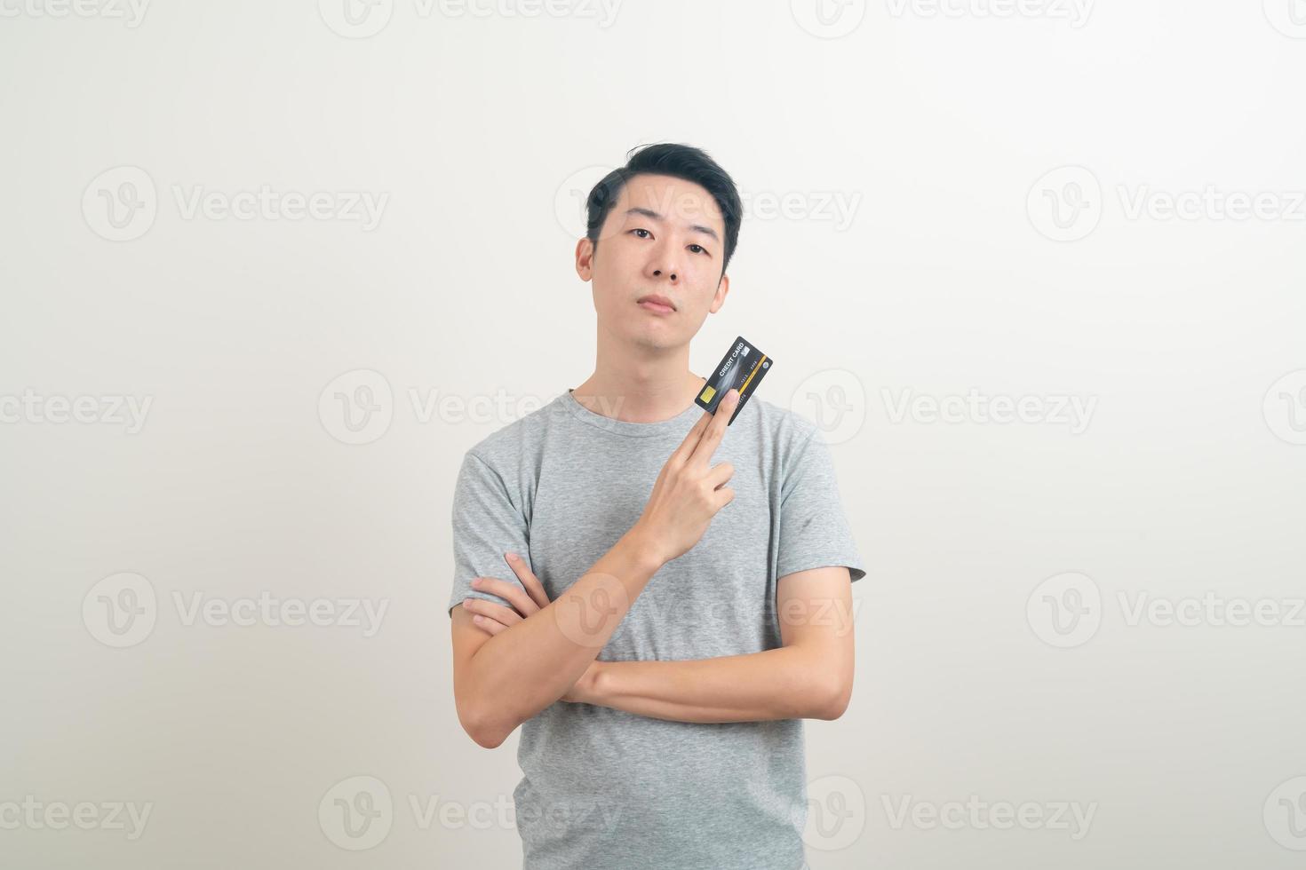 young Asian man holding credit card photo