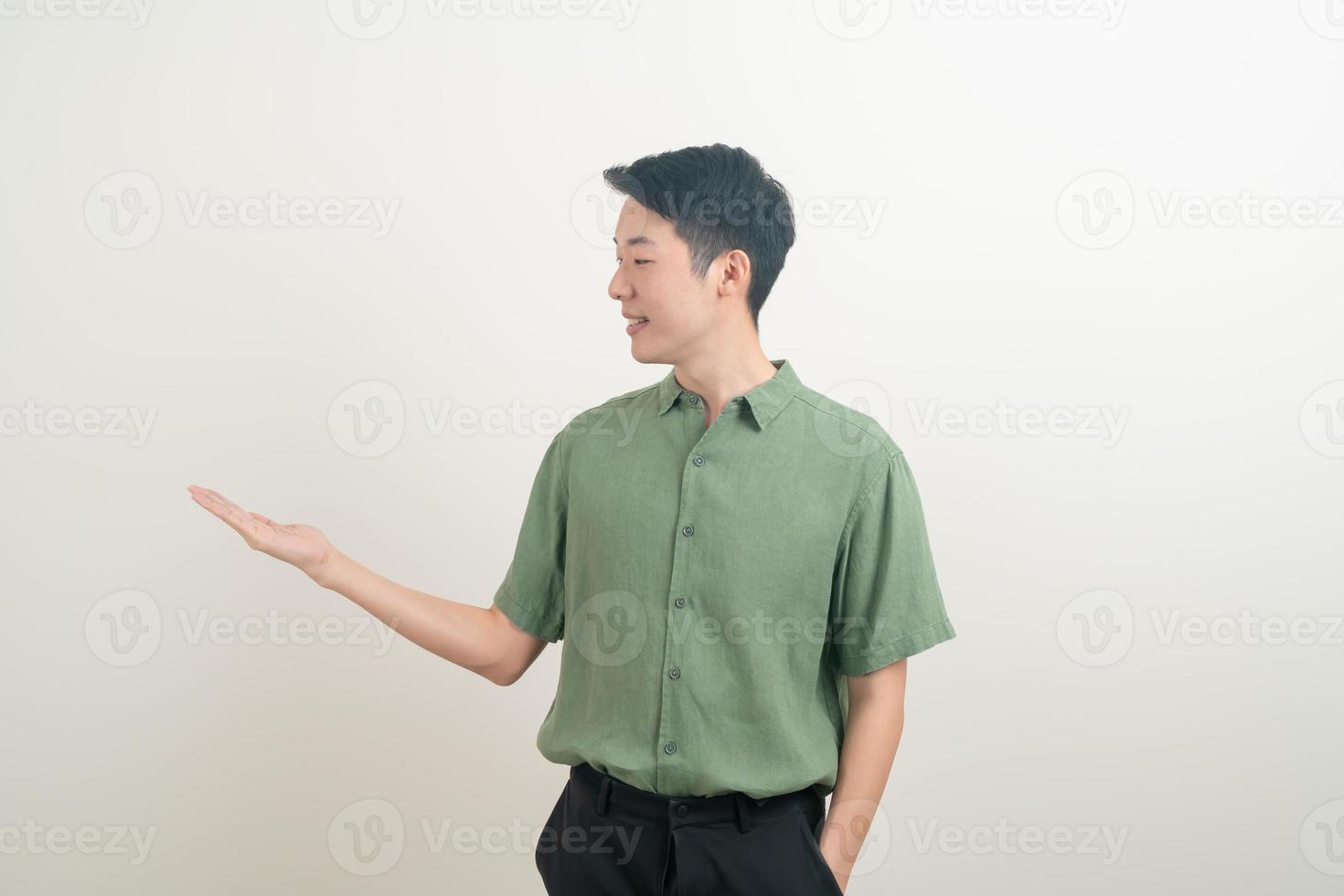 Asian man with hand pointing or presenting on white background photo