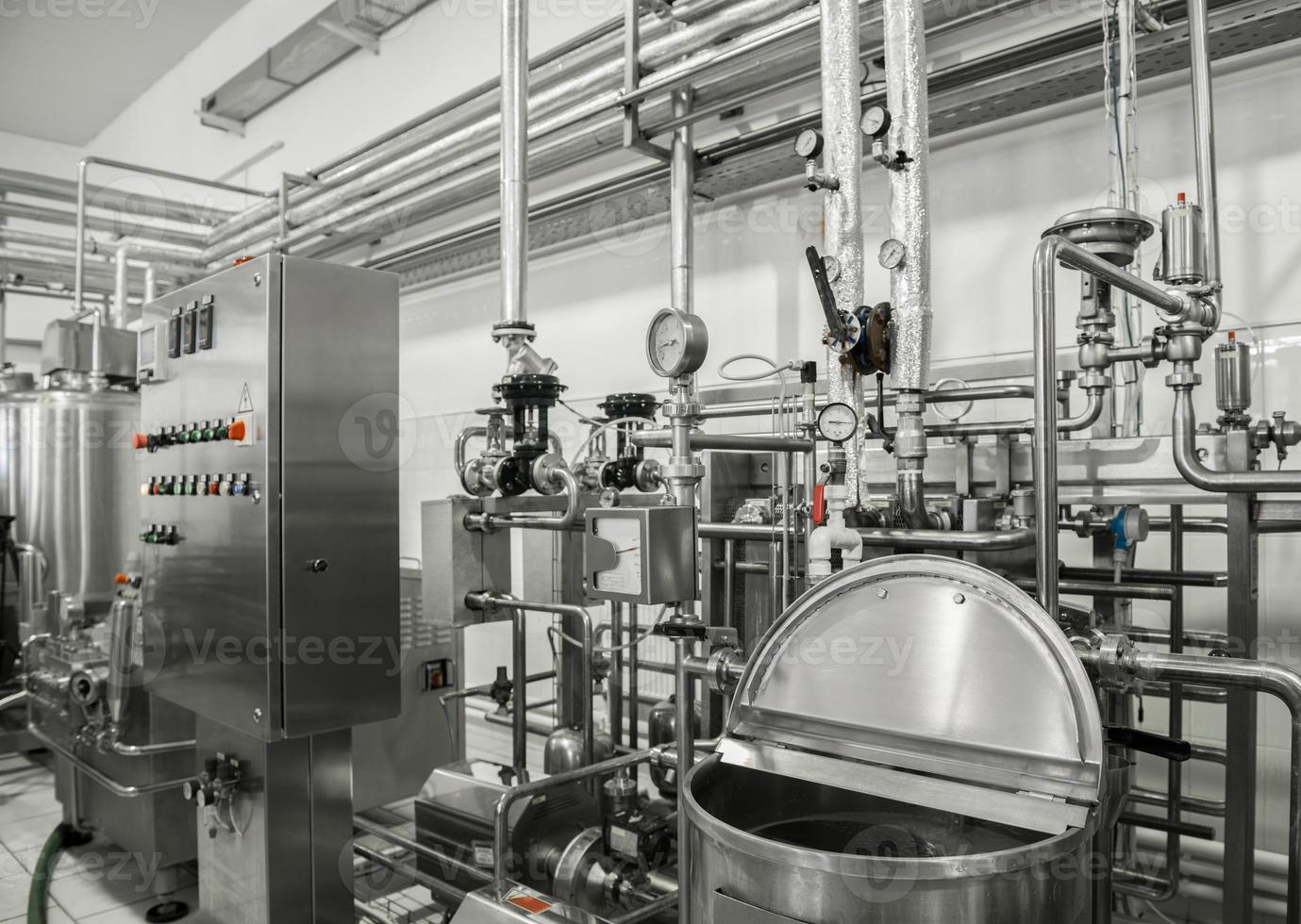 electronic control panel and tank at a milk factory. equipment at the dairy plant photo