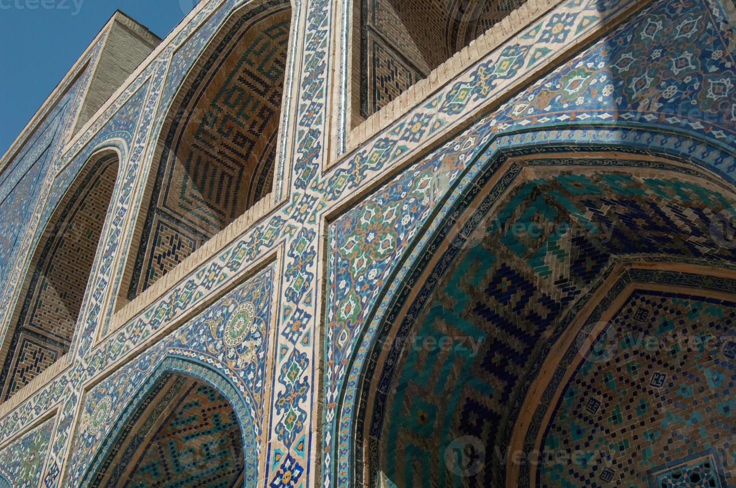 Arch and architecture of the ancient Registan in Samarkand. Ancient architecture of Central Asia photo