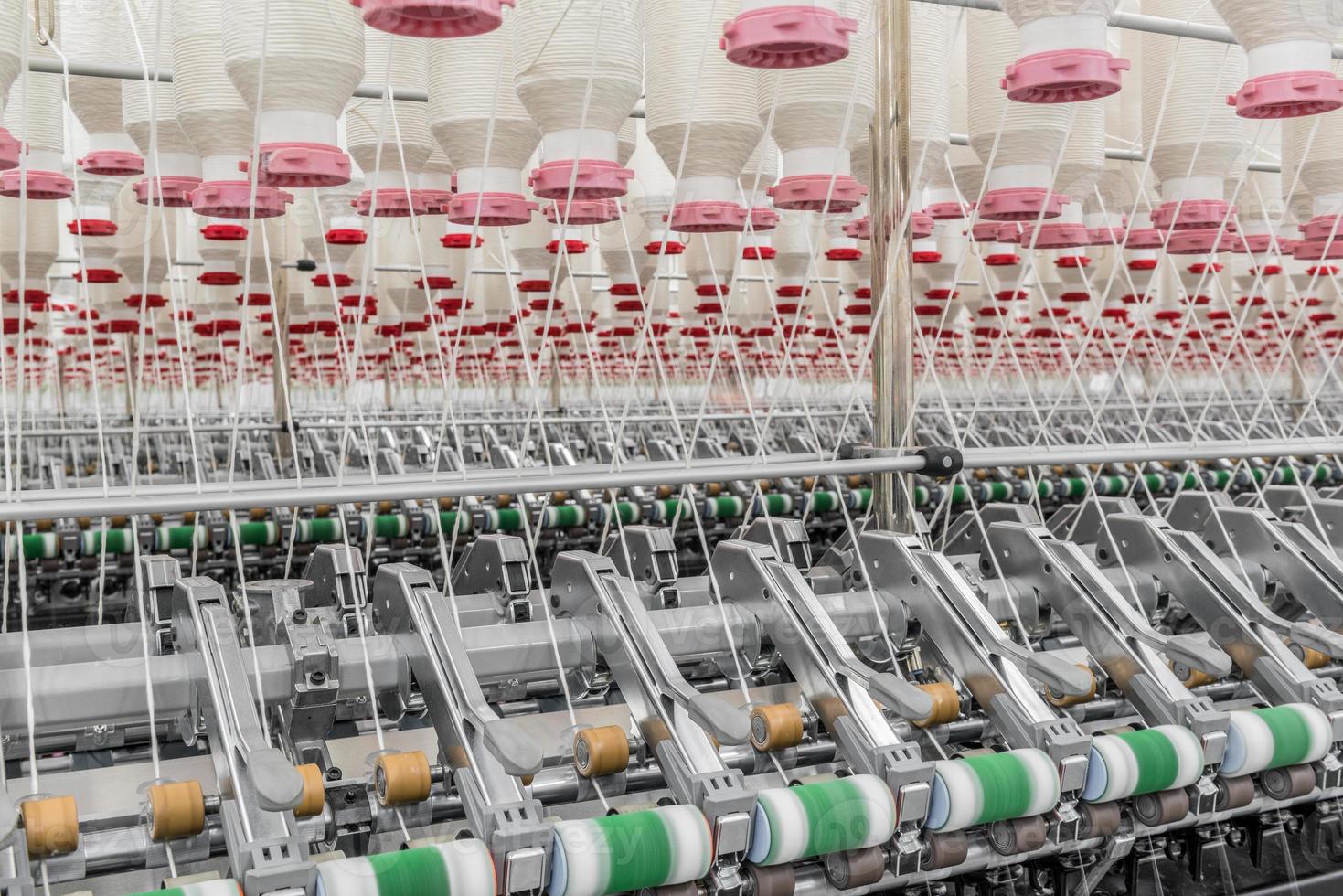 Machinery and equipment in the workshop for the production of thread. Industrial textile factory photo
