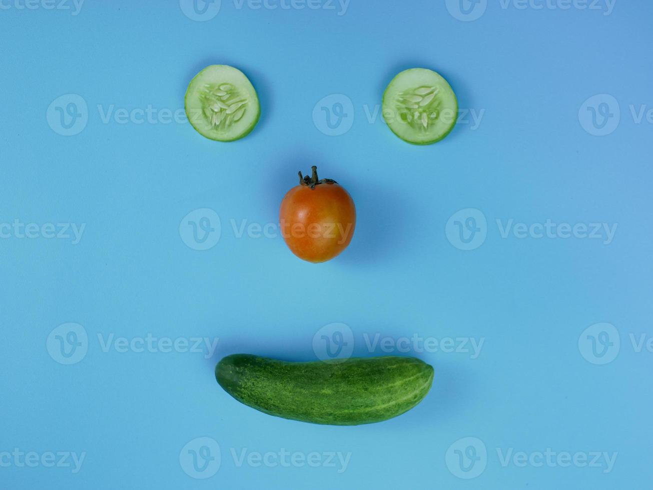 creative healthy food concept with a smiley face pattern. vegetables for diet photo