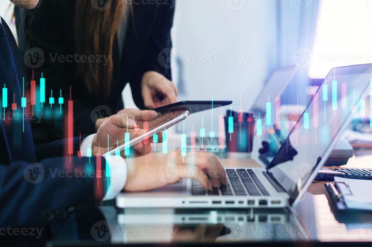 Two professional traides on technical price graph and indicator, red and green candlestick chart and stock trading computer photo