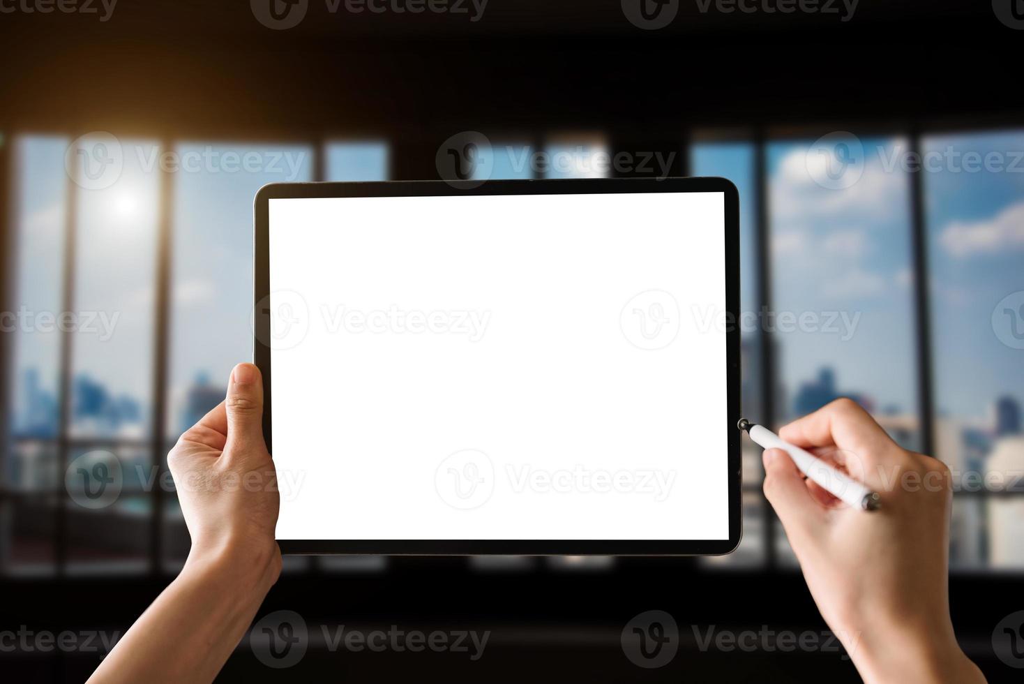 woman using blank screen tablet with stylus photo