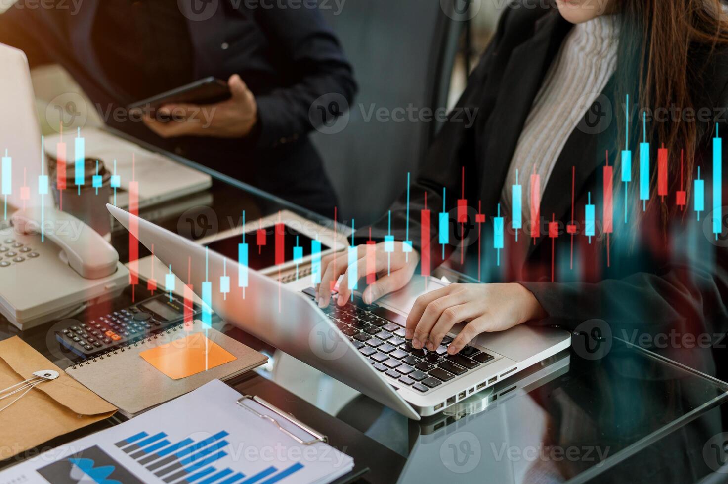 Attractive young european businessman using laptop with abstract forex chart. photo