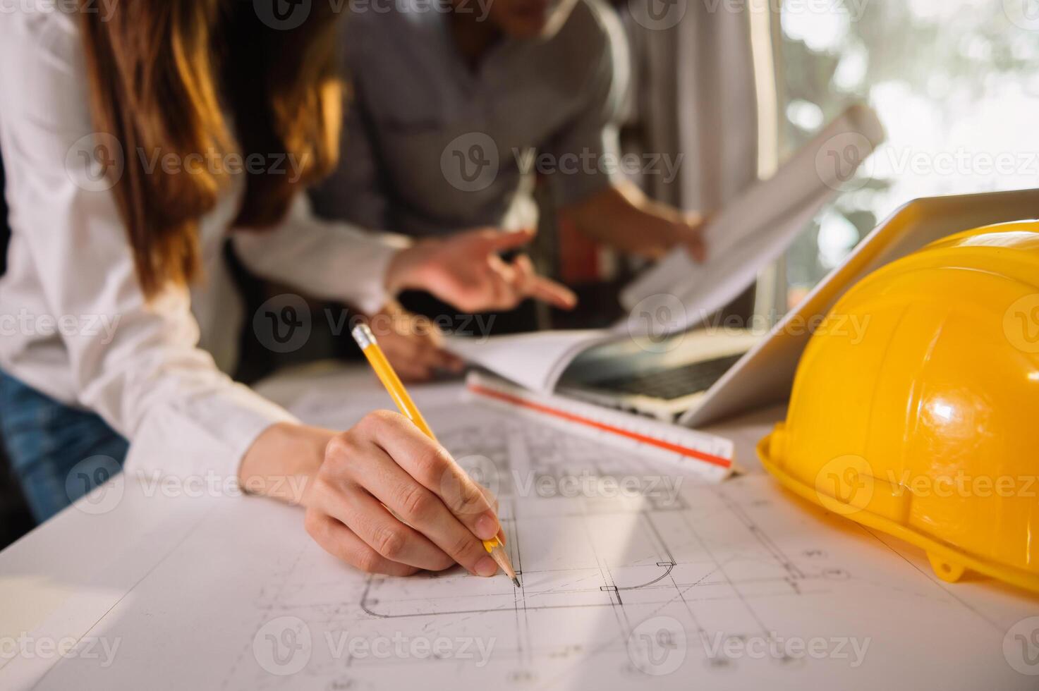 Creative architect projecting on the big drawings in the dark loft office or cafe in morning light photo