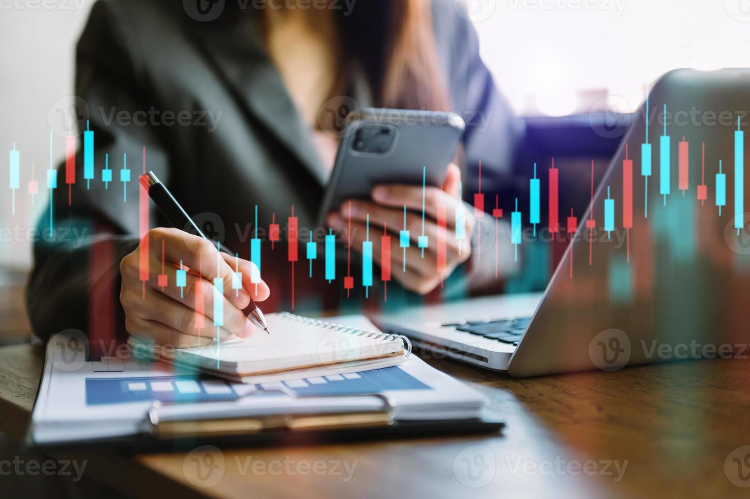 Attractive young european businessman using laptop with abstract forex chart. Investment photo