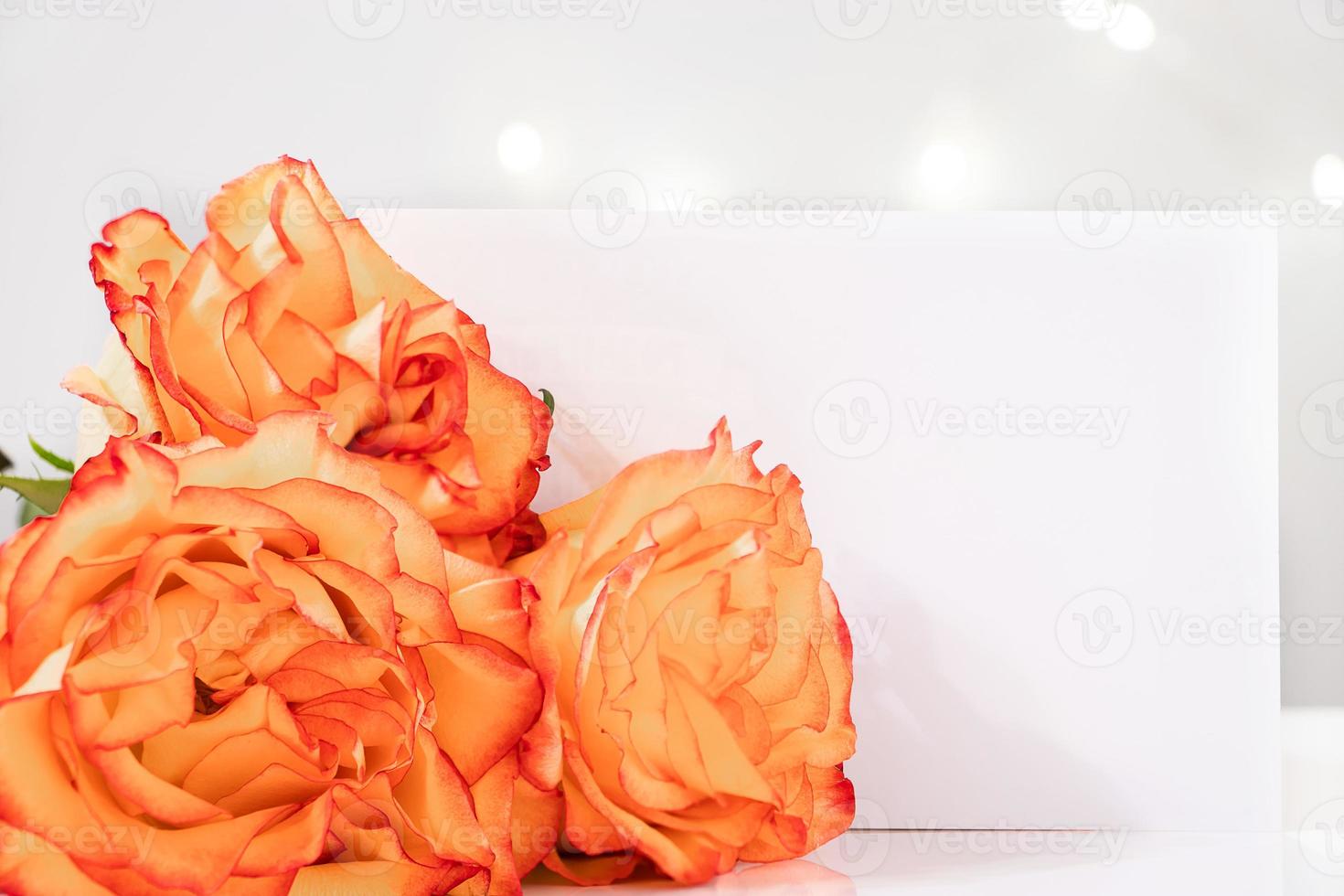 Bouquet of yellow roses and greeting card. photo