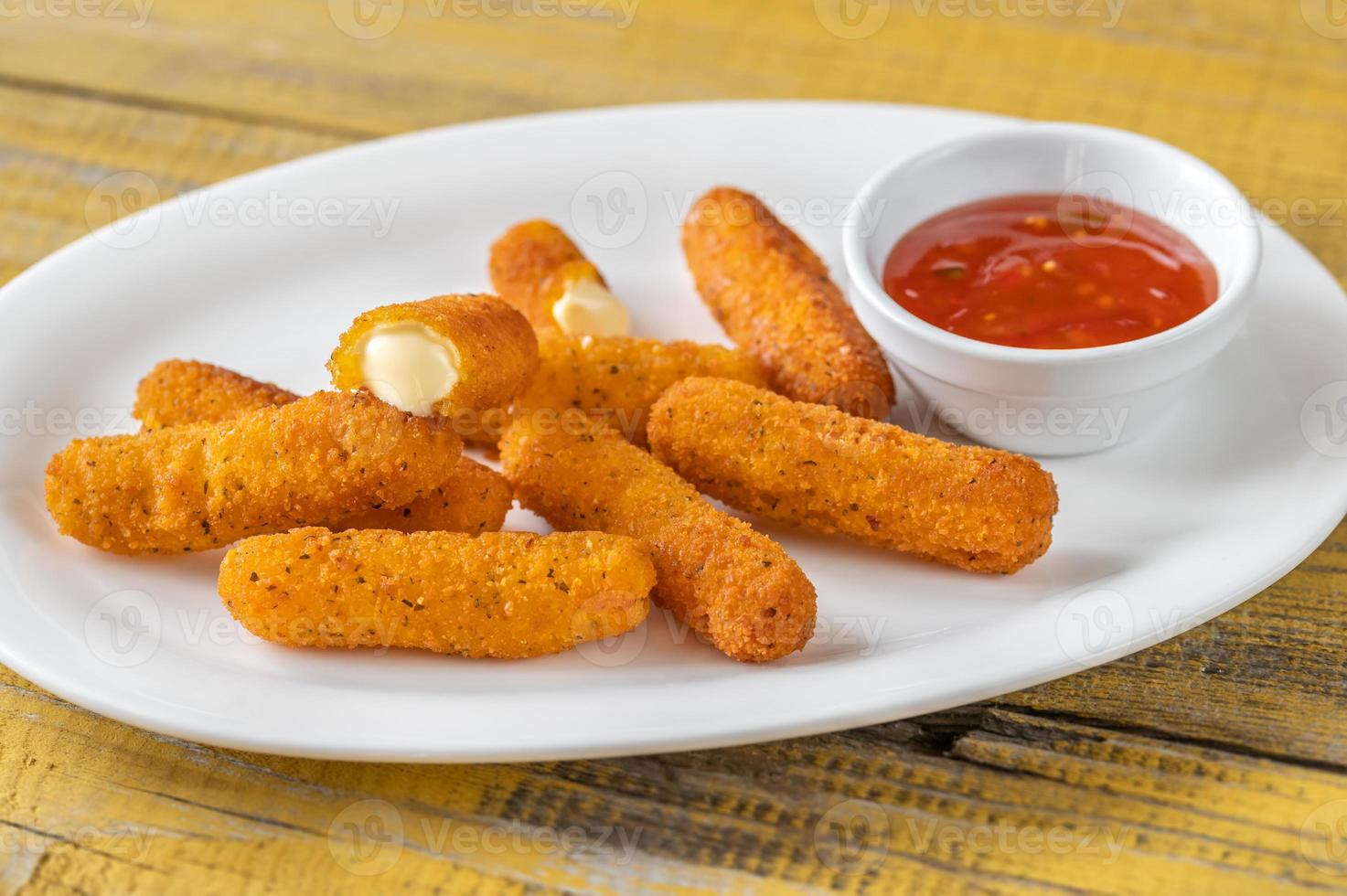 Mozzarella sticks with chili sauce photo