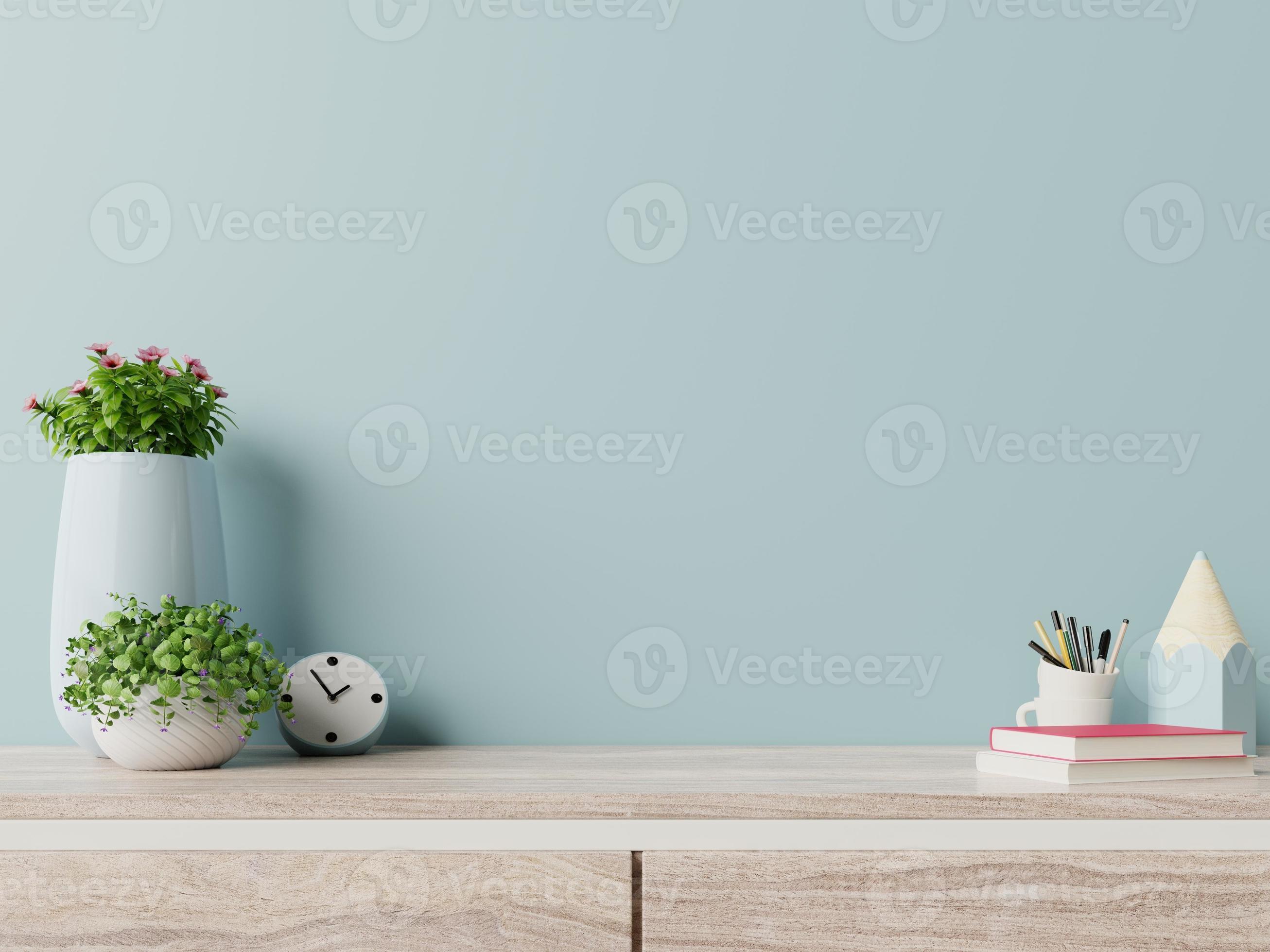 Modern workplace with creative desk with plants have blue wall. 5583911