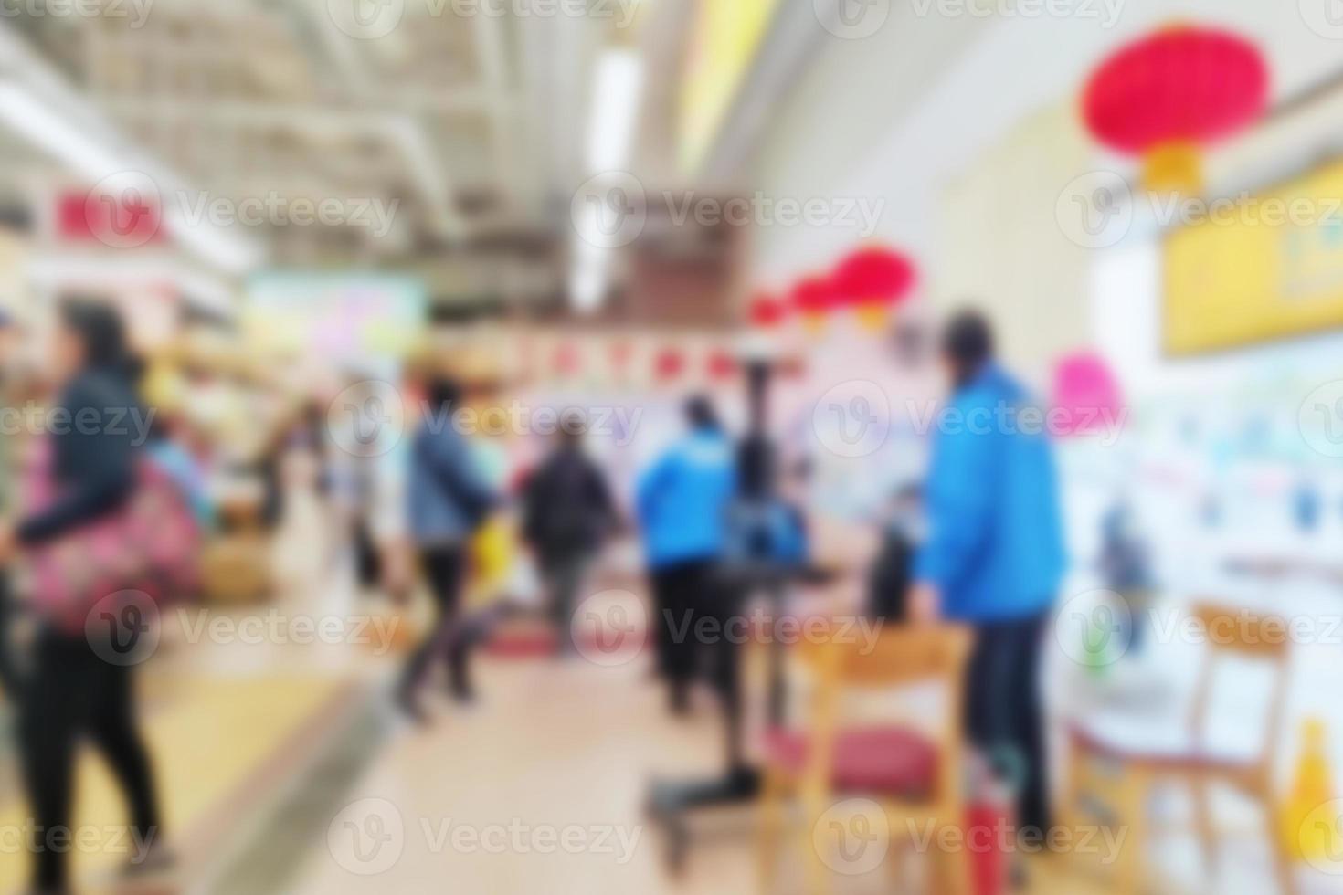 People at motion blur. Group of people walking open space. Defocused image photo