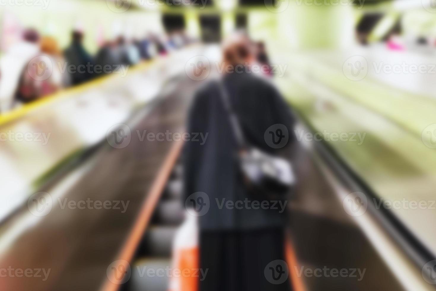 People at motion blur. Group of people walking open space. Defocused image photo