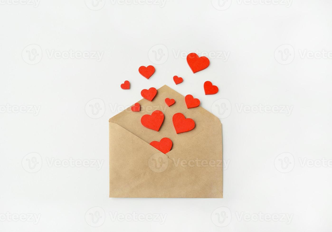 Valentine's Day. An envelope and red hearts. 14 February. Valentines day greeting card photo