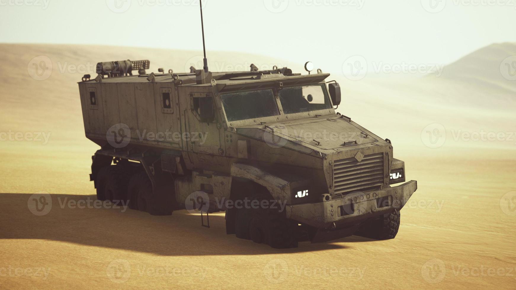Armoured military truck in desert photo