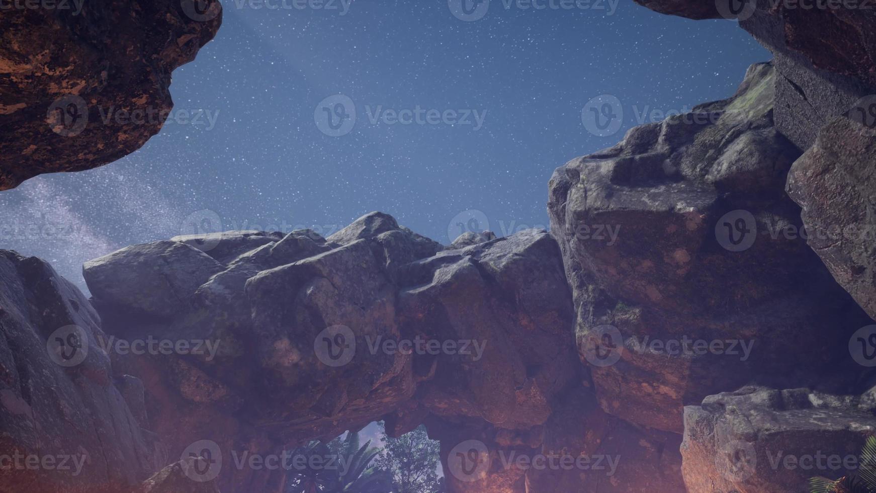 4K hyperlapse astrophotography star trails over sandstone canyon walls. photo