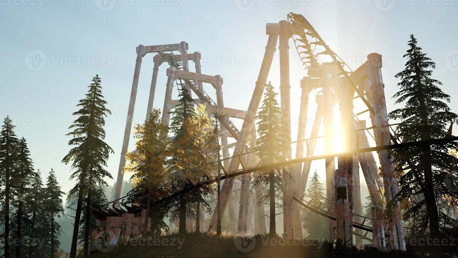 old roller coaster at sunset in forest photo