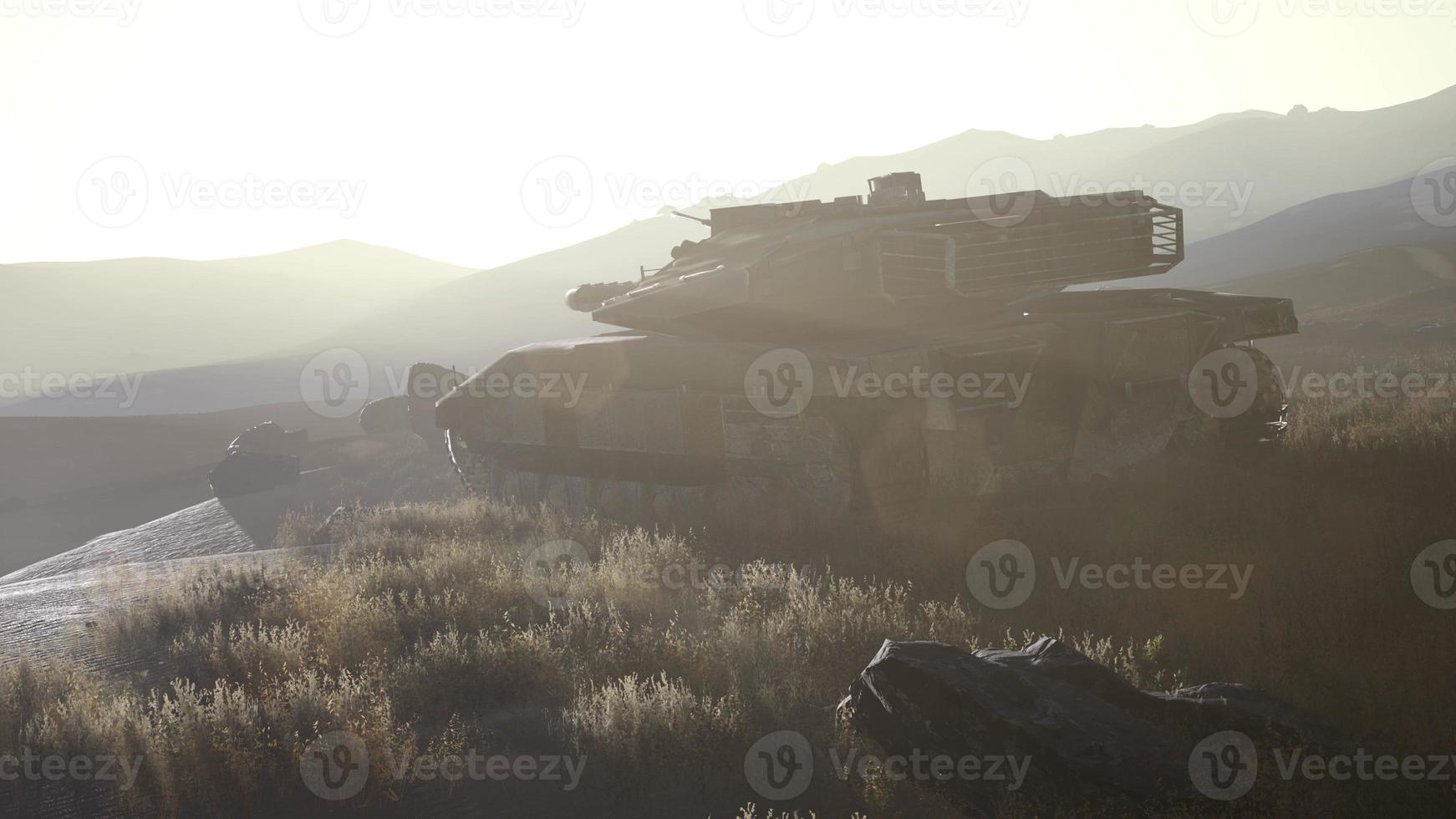 old rusty tank in the desert at sunset photo