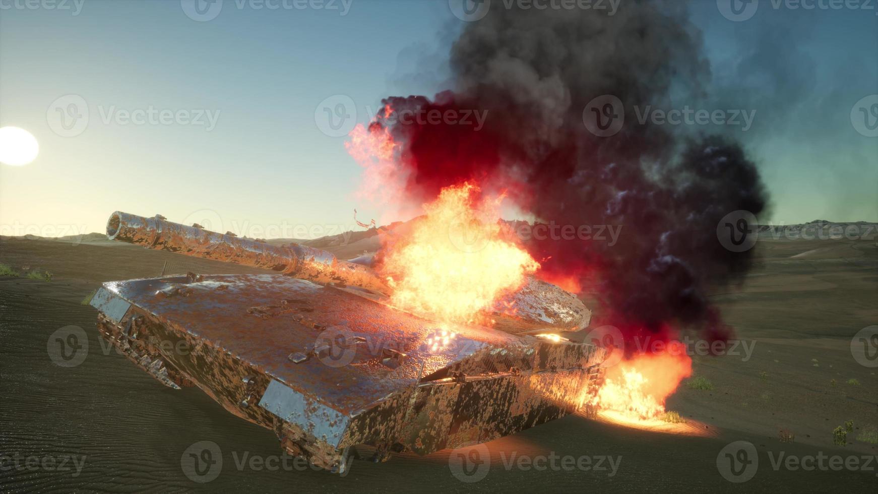 burned tank in the desert at sunset photo